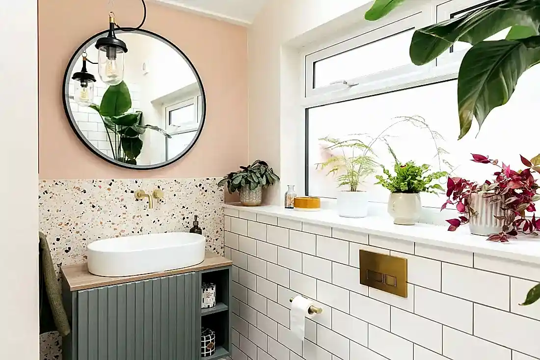 Pink and terrazzo tiled bathroom
