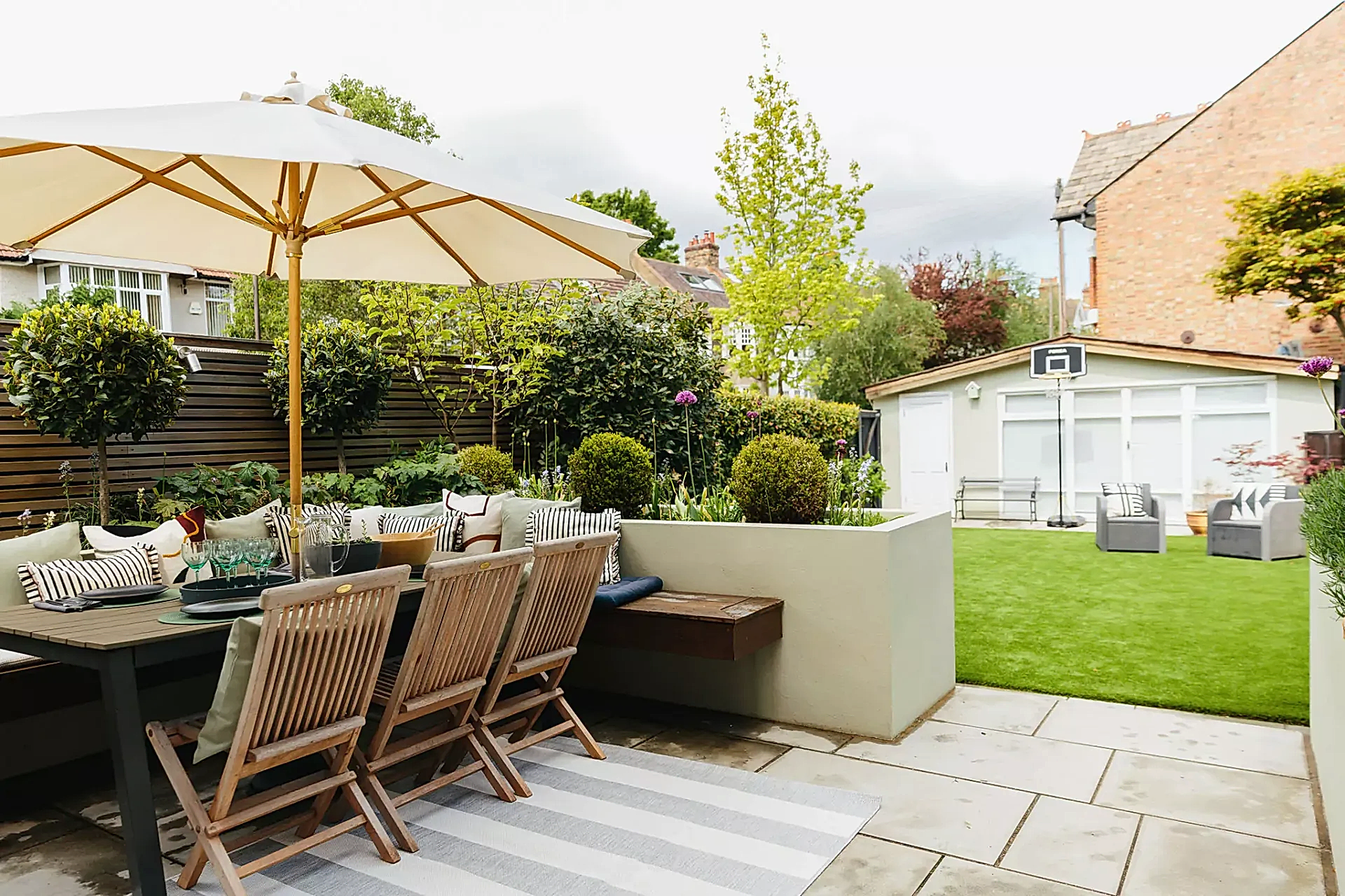 beautiful outdoor dining area with layered cushions