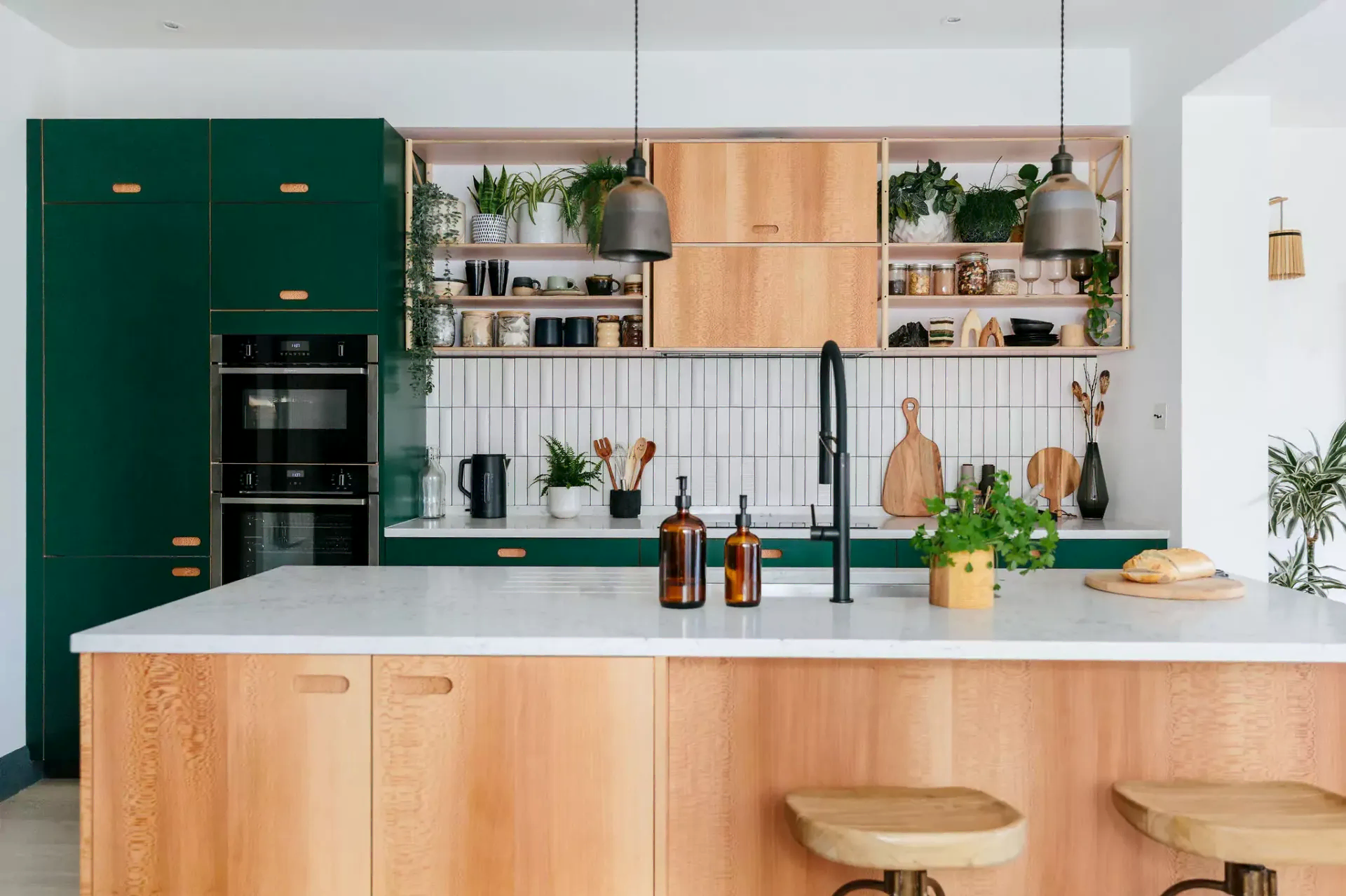 Green and wooden kitchen with marble worktops