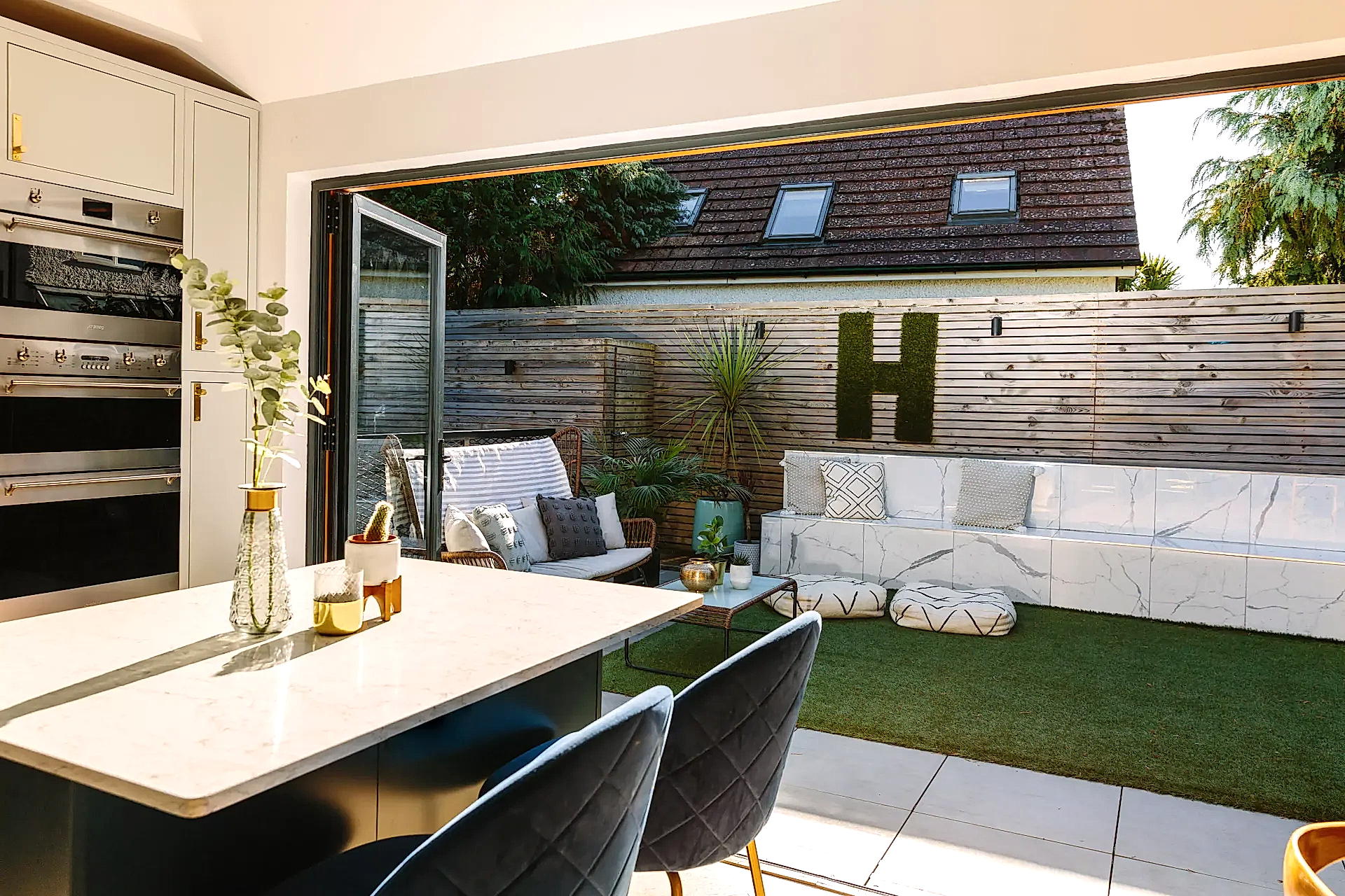 Kitchen with bifold doors opening into garden
