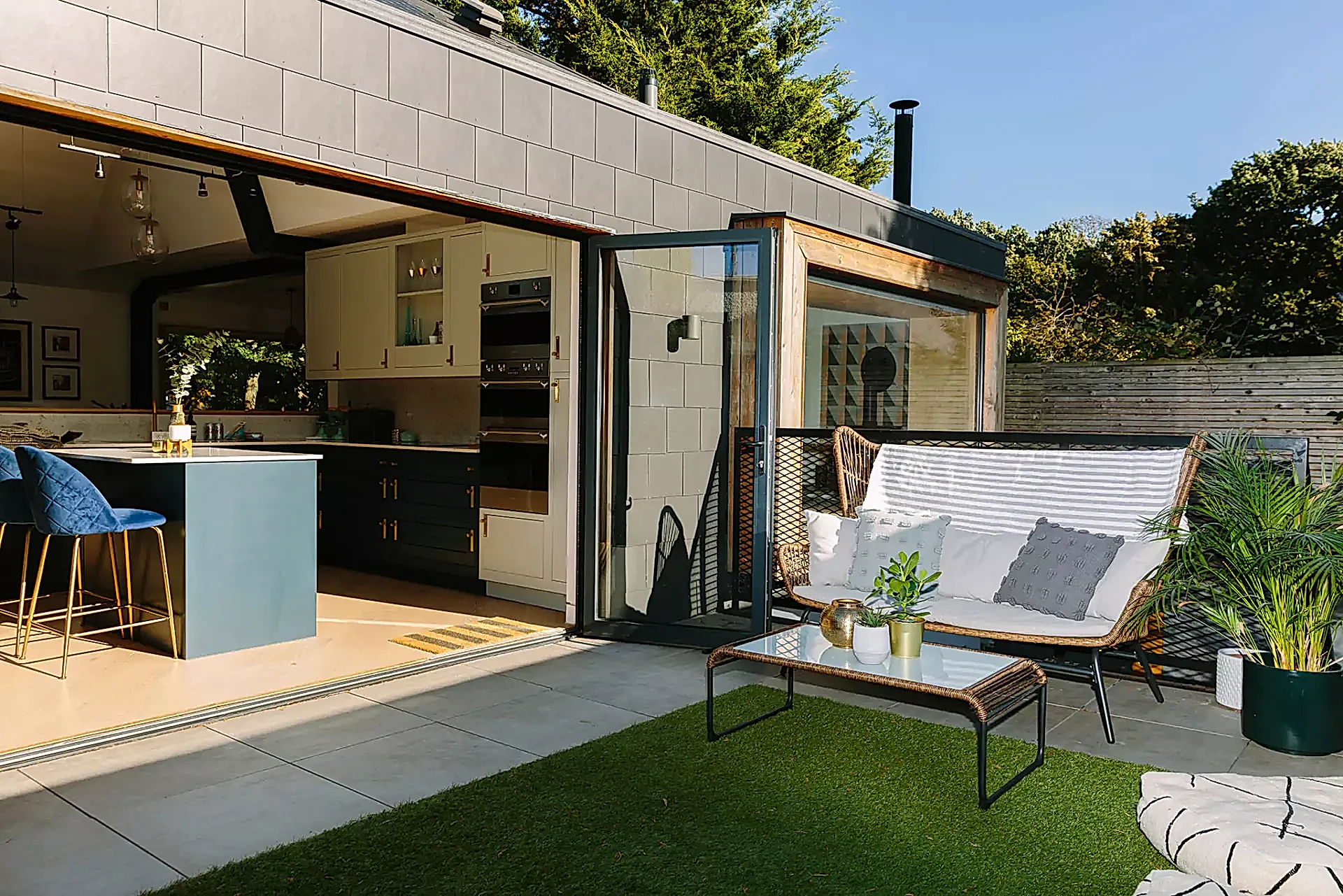 Kitchen bifold doors opening up into garden