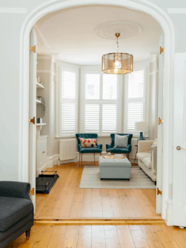 living room alcove with chairs and pillows
