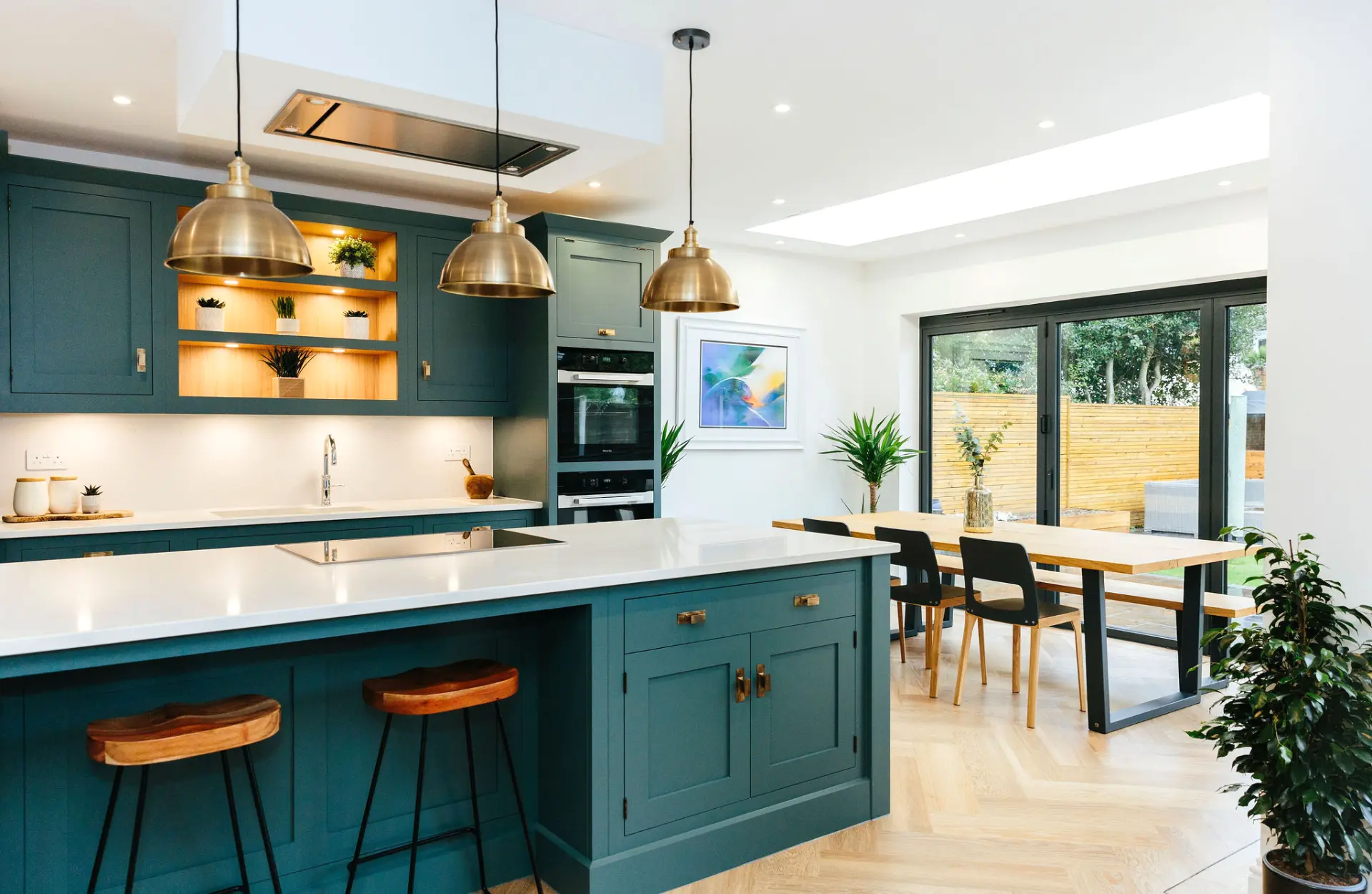 Blue and brass open plan kitchen diner 