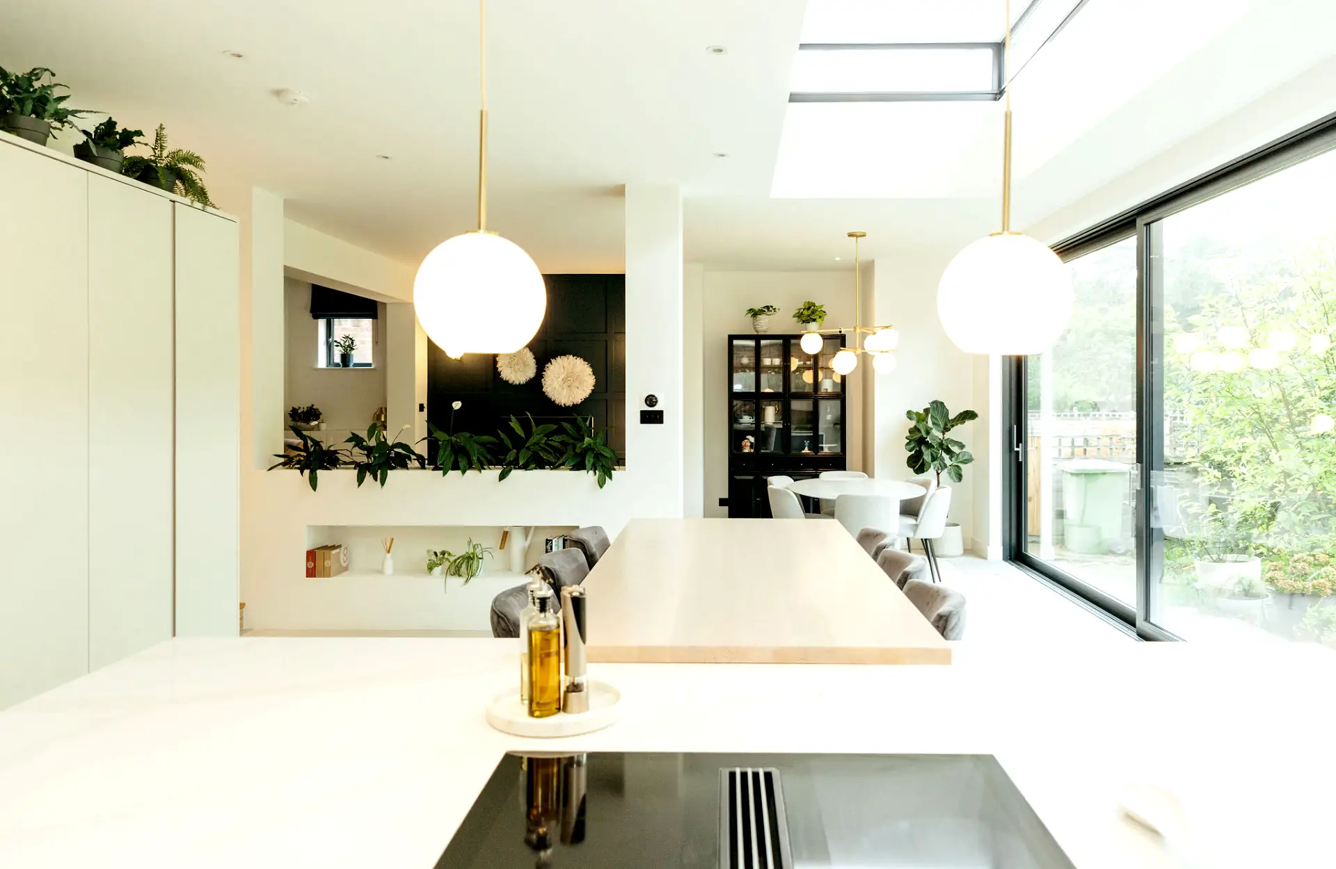 modern, white open plan kitchen and dining