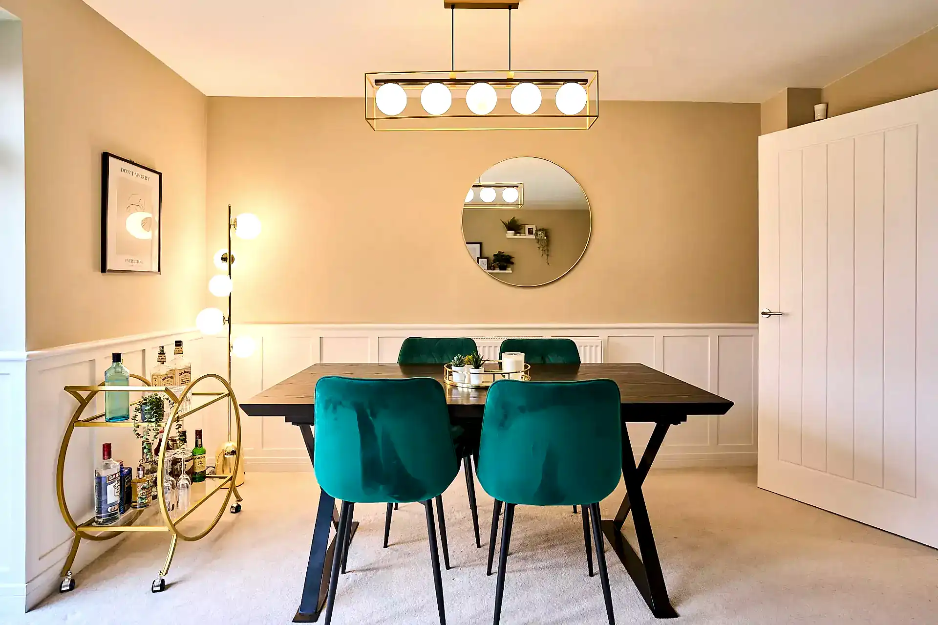 Open plan living-dining room with green accents